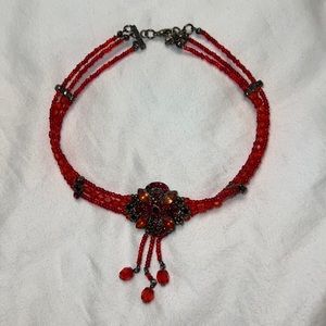 A red choker necklace worn couple of times, in very good condition.